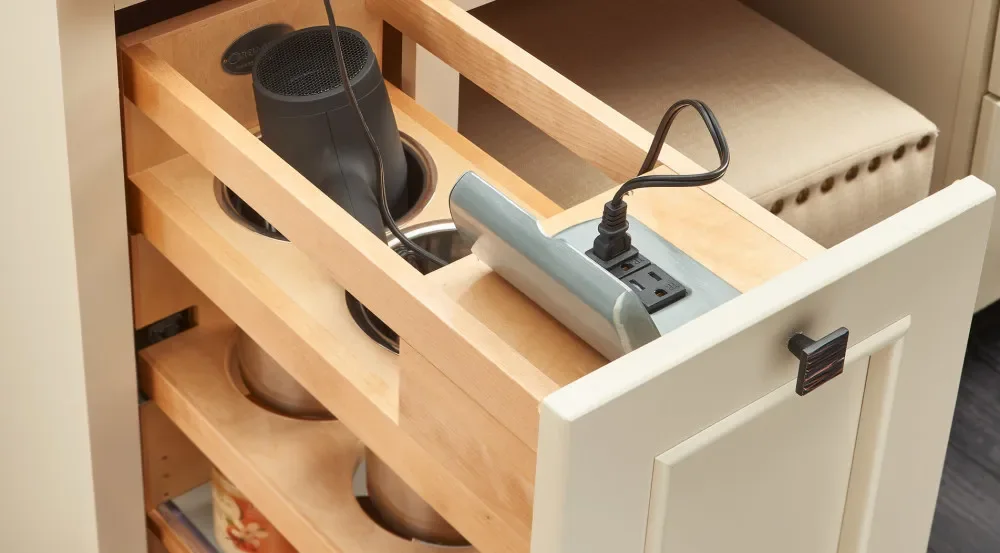 A wood vanity pull-out organizing hair tools and daily bathroom items