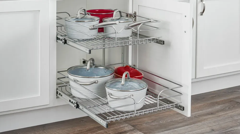 A corner cabinet organizer extended so cookware at the back is easy to reach